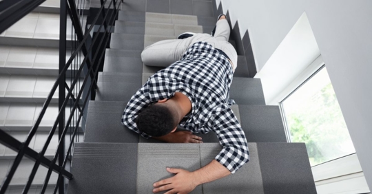 man falling down on stairs