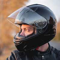 Motorcycle rider wearing a helmet.
