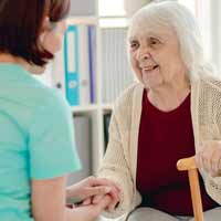 Nurse and an elderly woman.