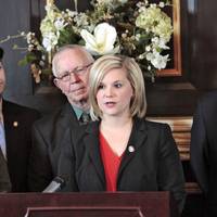 Photo - Emily Virgin, District 44, speaks during a House Democrats news conference to object to income tax cut in the House lounge at the Capitol, Wednesday, March 6, 2013. Photo By David McDaniel/The Oklahoman